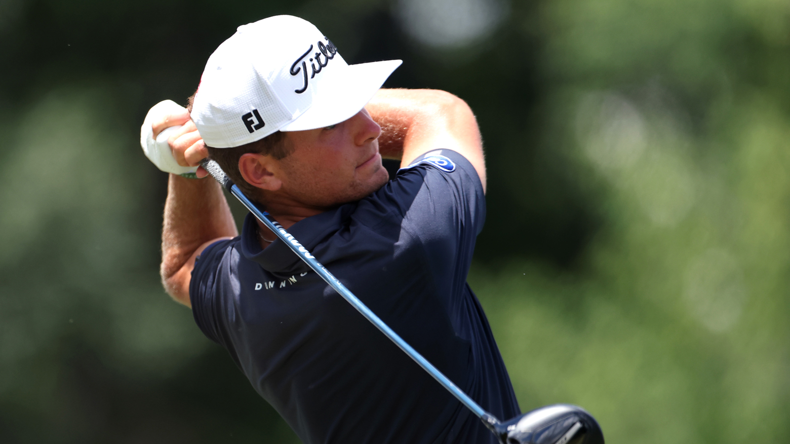 Michael Brennan hits a driver