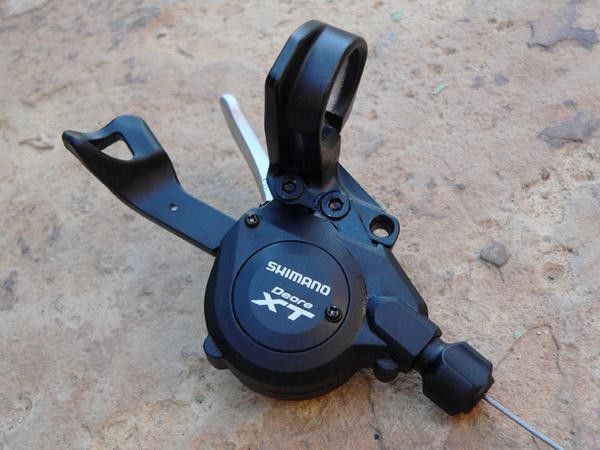 Trigger shifters sport two sets of mounting holes to provide a greater range of lateral adjustment relative to the brake levers.