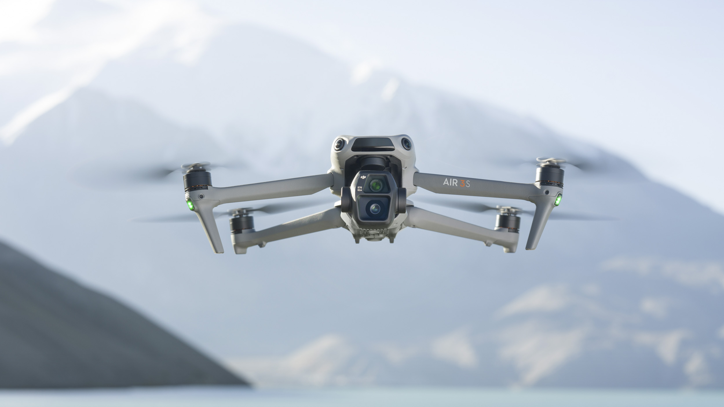 DJI Air 3S in flight with snow capped mountain backdrop