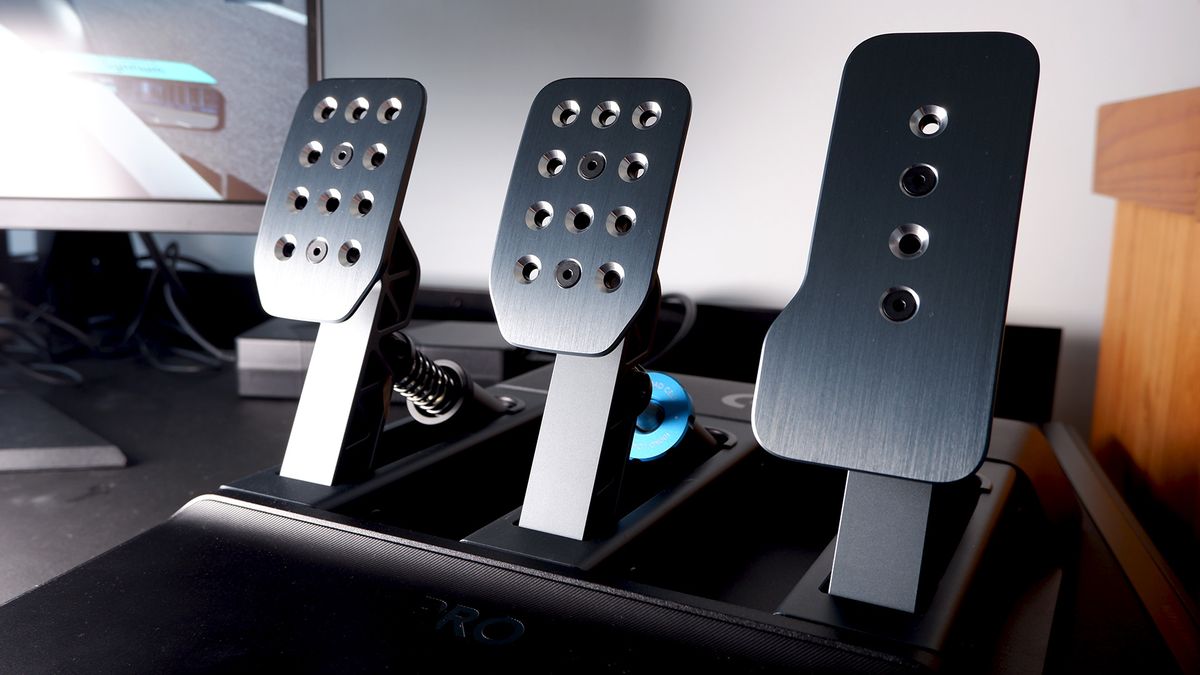 Logitech G Pro Racing Wheel and Pedals installed on a computer desk