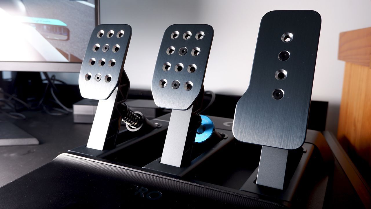Logitech G Pro Racing Wheel and Pedals installed on a computer desk