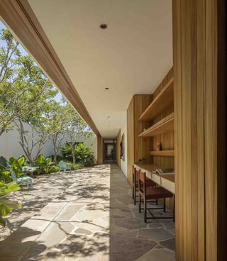 Indoor-outdoor space at Brazilian home. Photography: Fernando Guerra