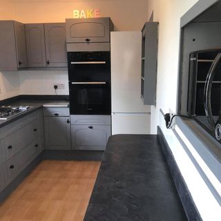 kitchen with cabinet and grey drawers