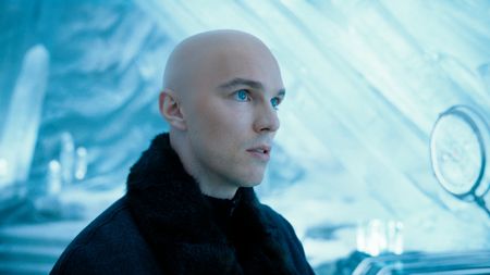 Nicholas Hoult stands with curiosity in the Fortress of Solitude in Superman. 