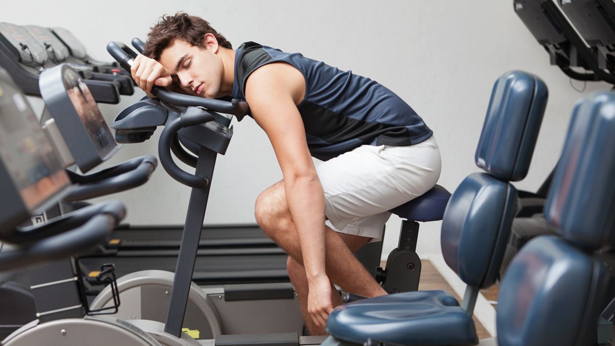 Man asleep on exercise bike