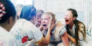 Florence Pugh surrounded by Harga women in Midsommar