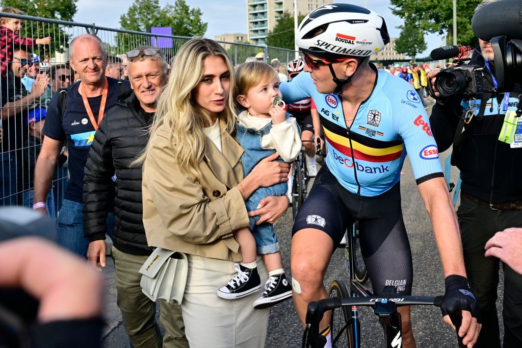 Winner Belgian Tim Merlier with partner Cameron Vandenbroucke and their son Jules after the Men's Elite Road Race at the European Championship 2024, in Hasselt, Sunday 15 September 2024. The UEC Road European Championships 2024 will take place from 11 to 15 september in Limburg, Belgium. BELGA PHOTO DIRK WAEM (Photo by DIRK WAEM / BELGA MAG / Belga via AFP)