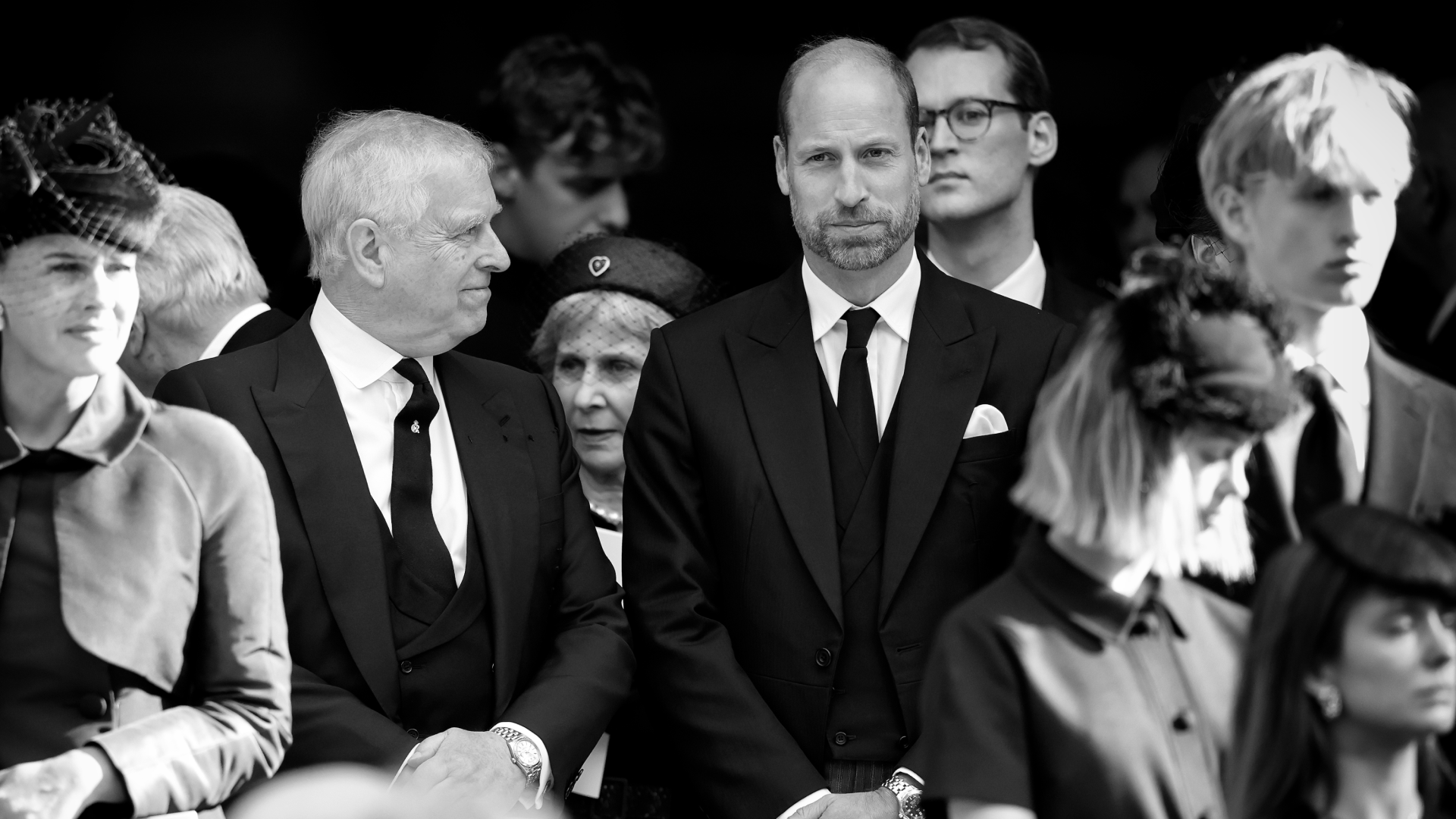 Prince William, wearing a black suit at Duchess of Kent&#039;s funeral, looking serious as Prince Andrew turns to smile at him