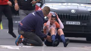 Annemiek van Vleuten sits on the ground after her crash at the start of the Team Relay