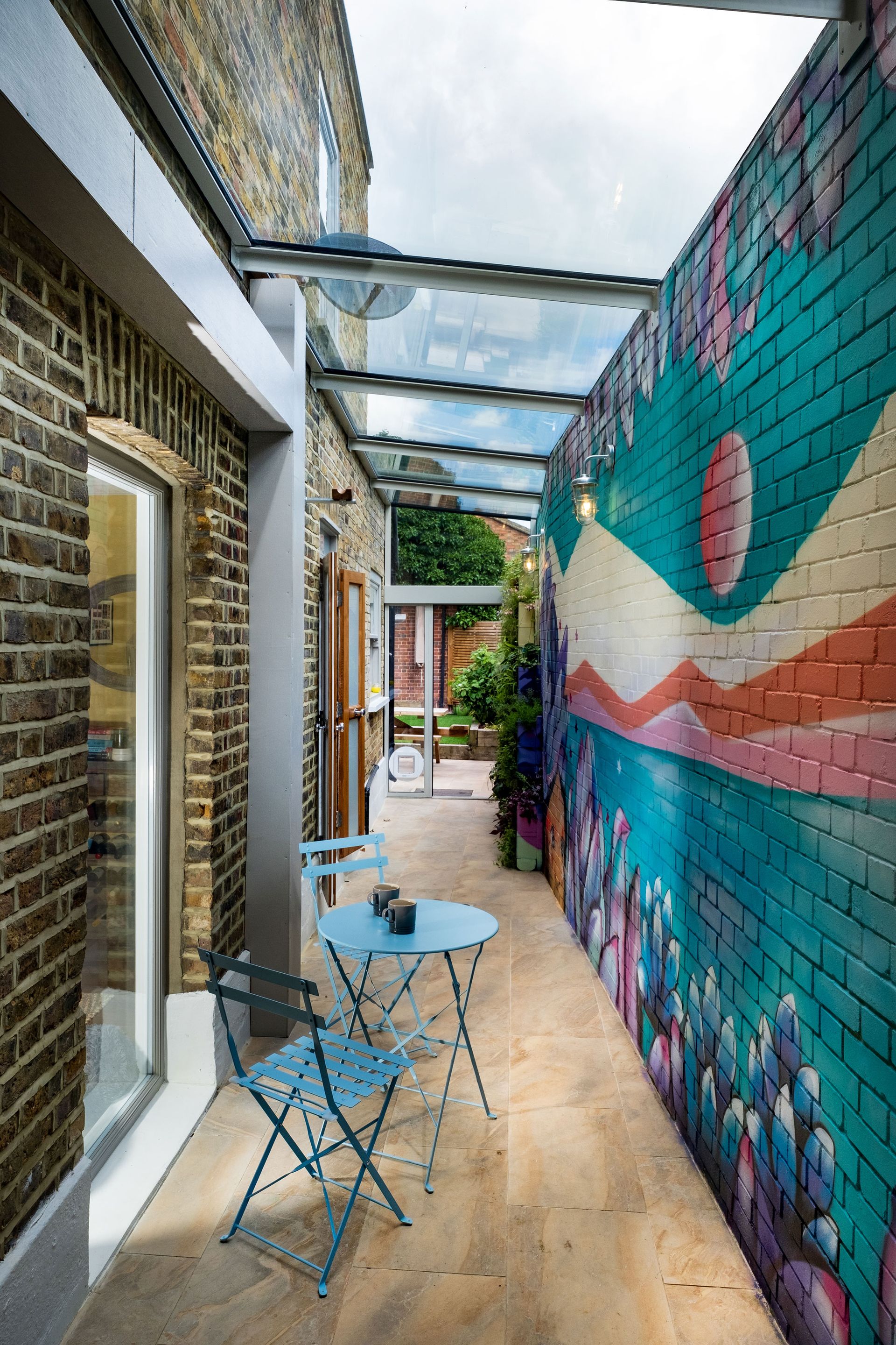 a painted wall mural in a side return extension