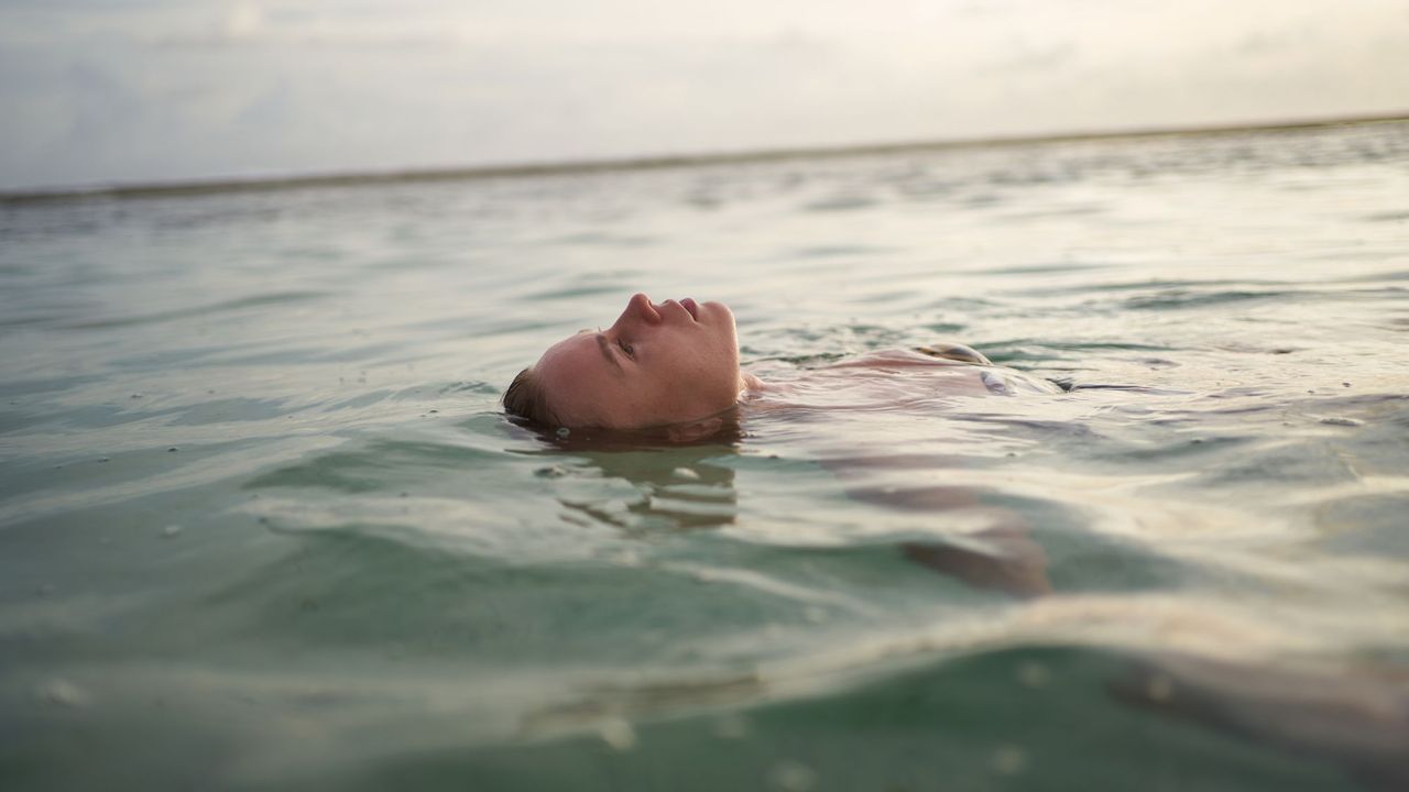 Woman floating in the sea