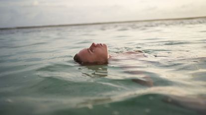 Woman floating in the sea