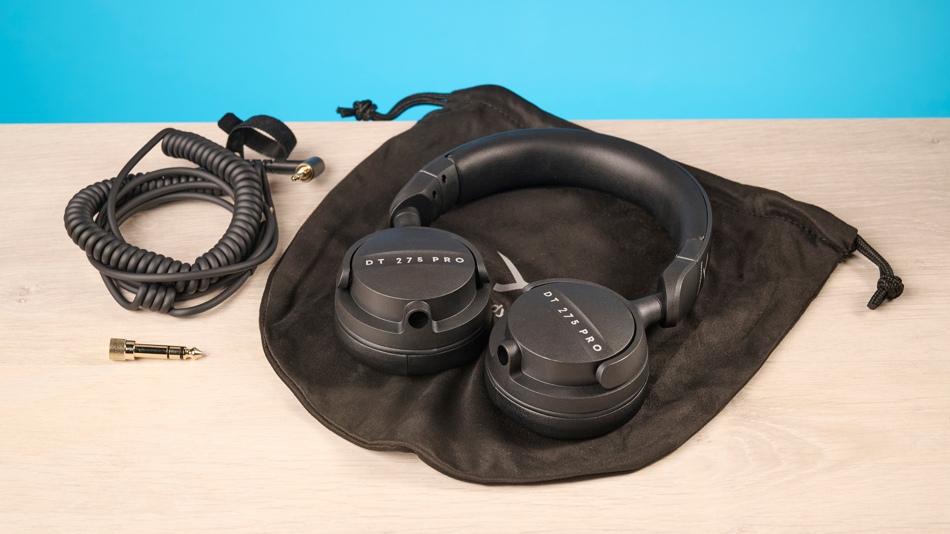 Beyerdynamic DT 275 Pro photographed in front of a blue background
