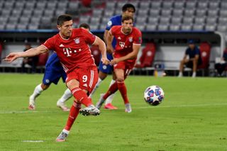 Bayern Munich’s Robert Lewandowski scores a penalty