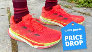 Person wearing the Adidas Supernova Prima on a sidewalk