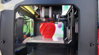 A 3D printer in the process of printing a vase at World Maker Faire on Sept. 22, 2013.