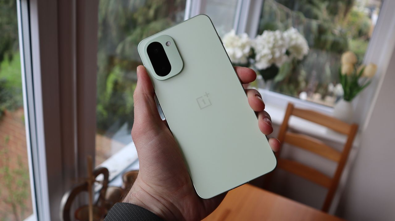 OnePlus 15R being held in the hand