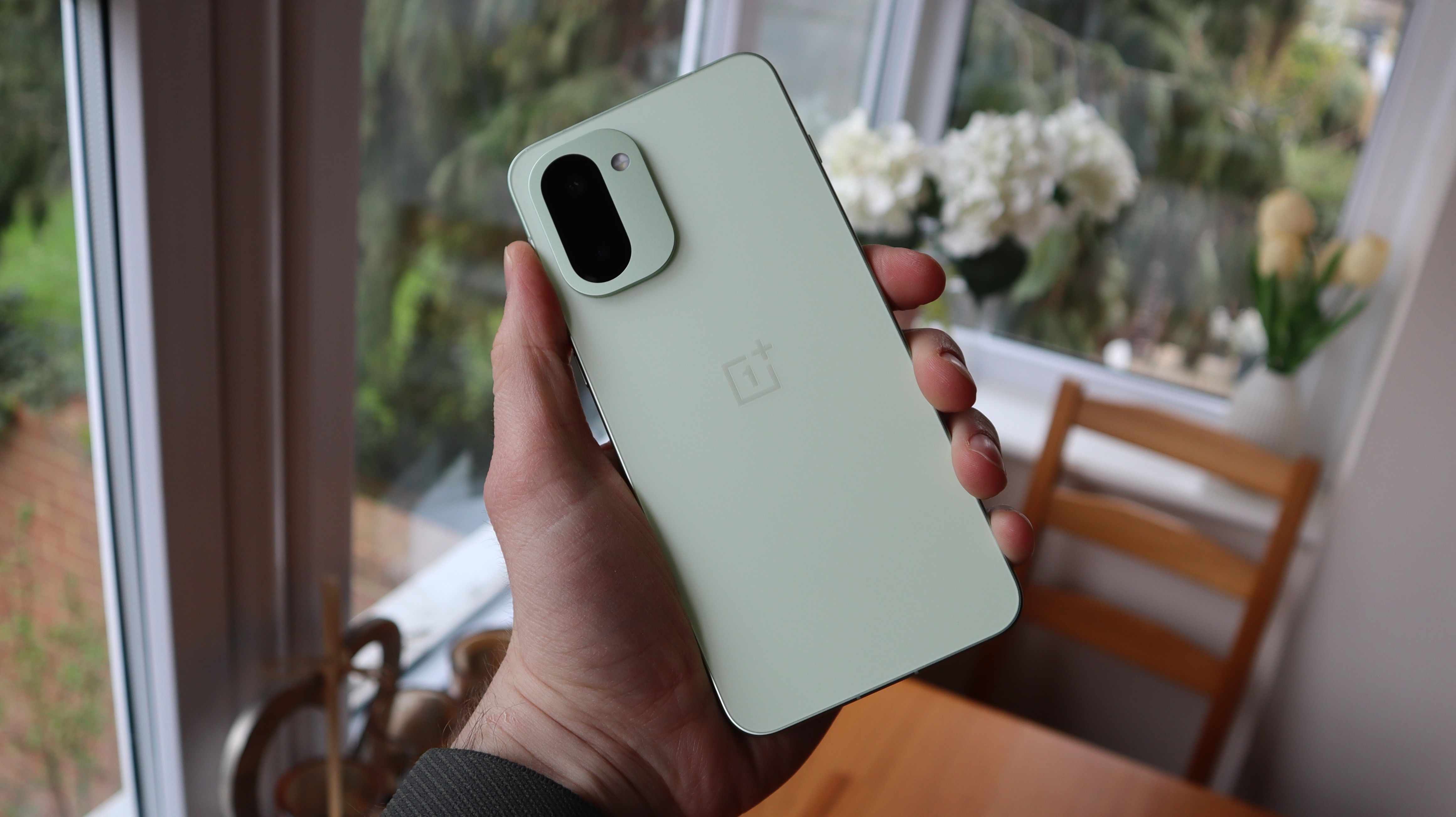 OnePlus 15R being held in the hand