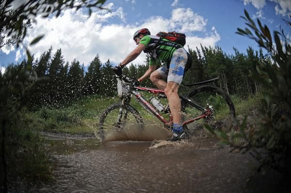 A racer crosses a stream