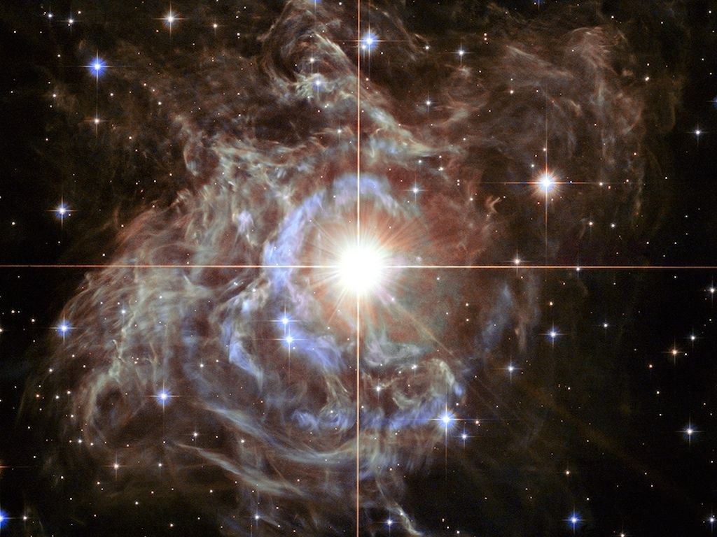 A Hubble Space Telescope image shows RS Puppis, one of the cepheids used to measure the expansion of the universe.