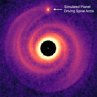 A simulation shows a small red planet sculpting the orange rings of gas around a young star into distinct spirals