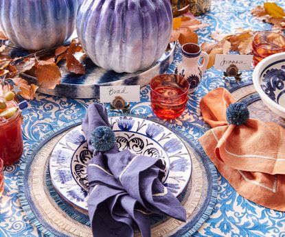 Blue tablecloth, orange and blue napkins