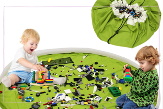 Children playing with Lego on a play mat
