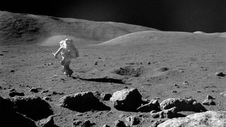 This 1972 photo shows scientist-astronaut Harrison H. Schmitt, the lunar module pilot on Apollo 17, exploring the moon with his adjustable sampling scoop. 