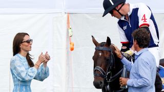 Kate Middleton watching Prince William on horseback prepare for Polo