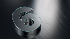 The number six outlined in green against a slate background.