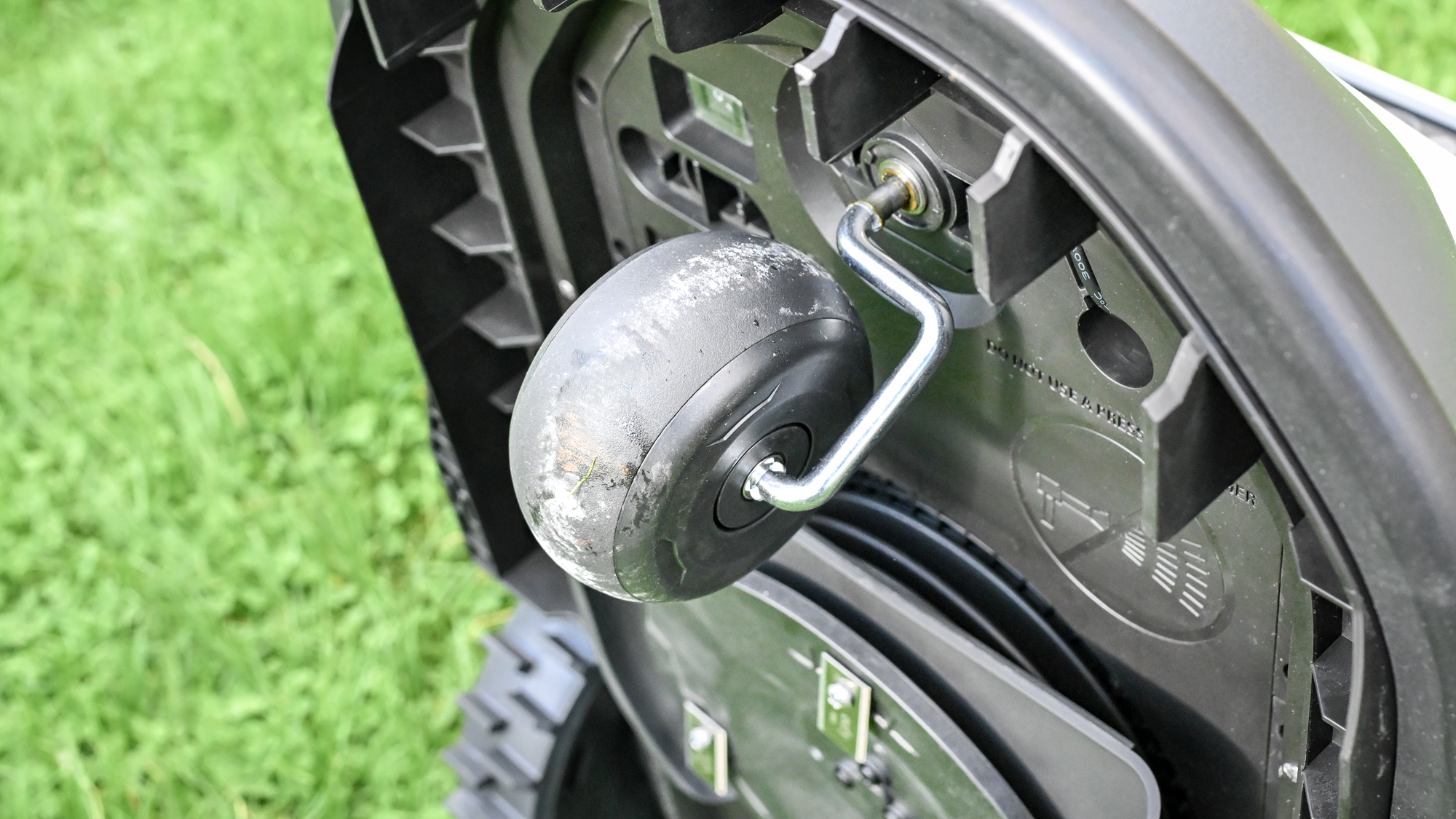 The Eufy E15 robot lawnmower front wheel