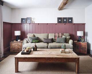 sitting room with pink tongue and groove, neutral sofa and wooden coffee table