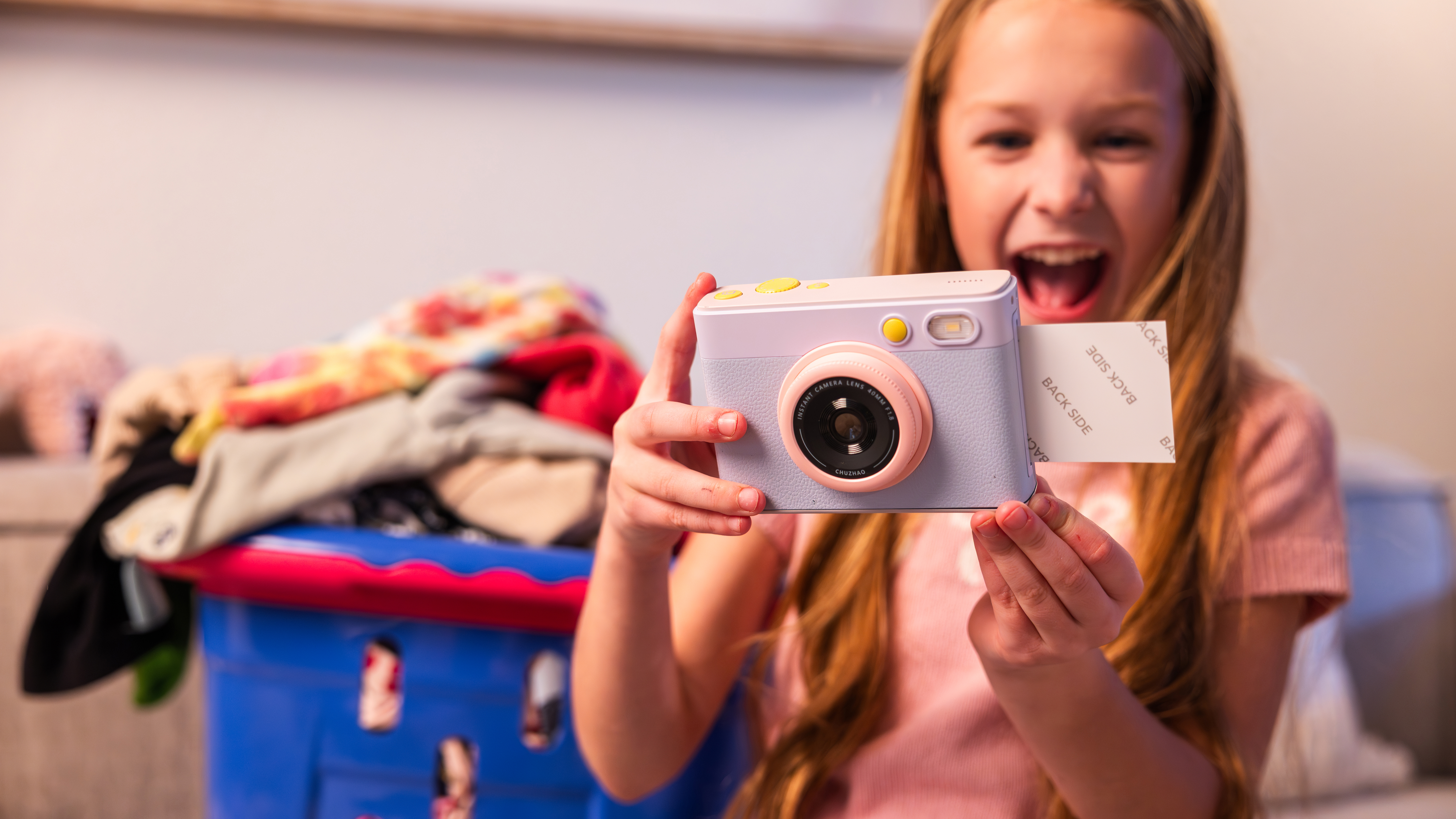 A child holds the myFirst Insta Lux camera