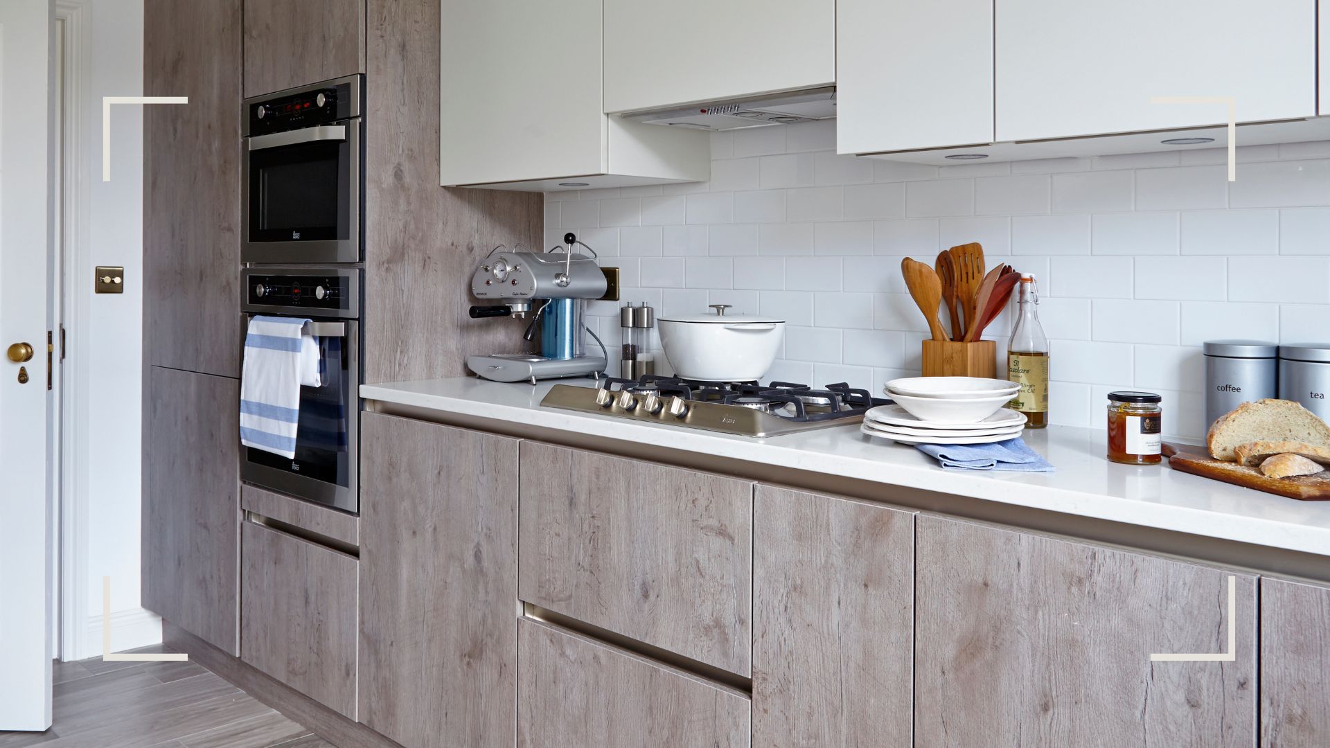 Grey wooden kitchen cabinets along one wall to show small kitchen storage essentials