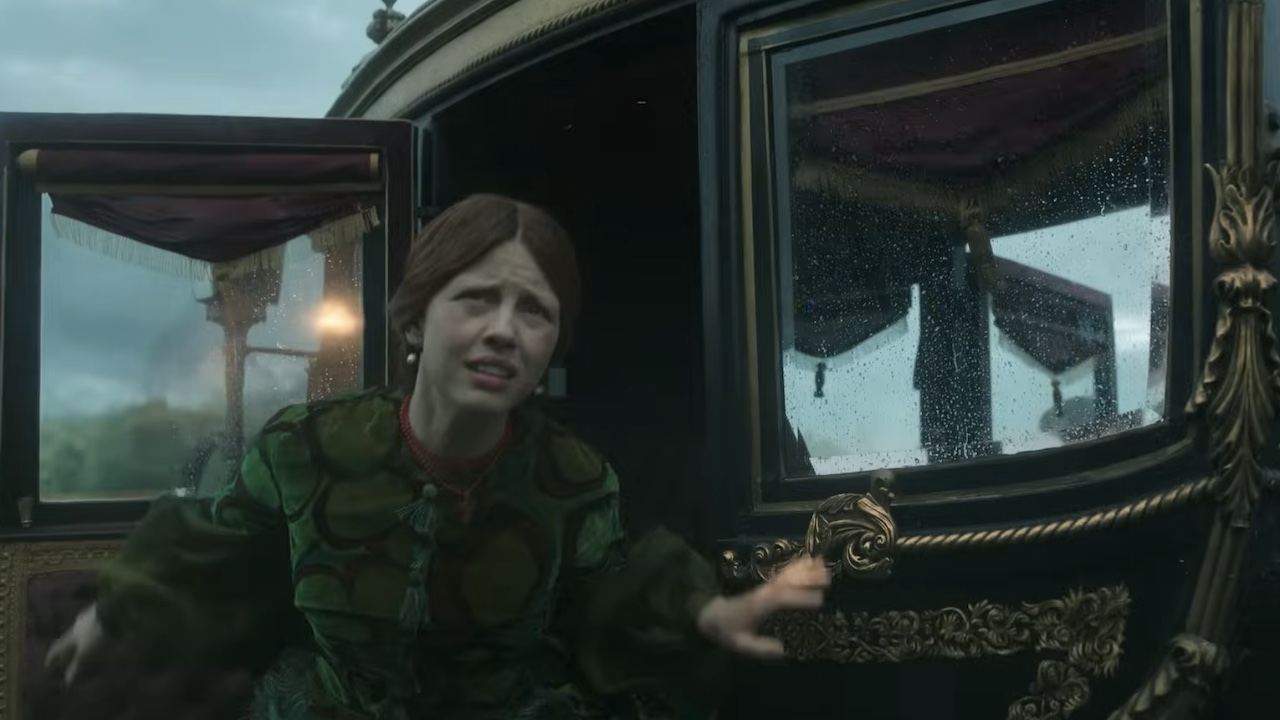 Mia Goth looking concerned, stepping out of a carriage in Frankenstein
