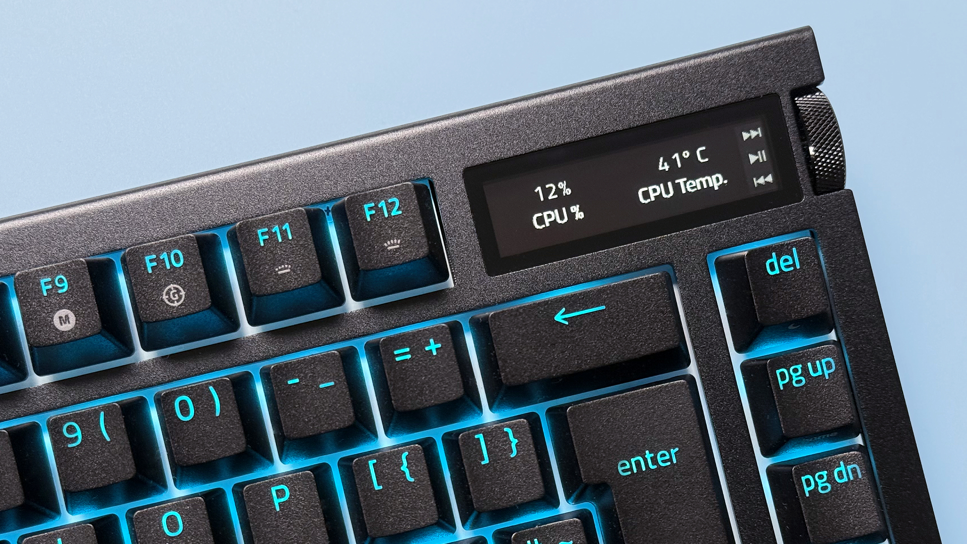 Razer BlackWidow V4 Pro 75% keyboard from various angles on a light blue background