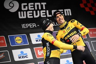 Jumbo-Visma teammates Wout van Aert in second-place and winner Christophe Laporte celebrate on the podium