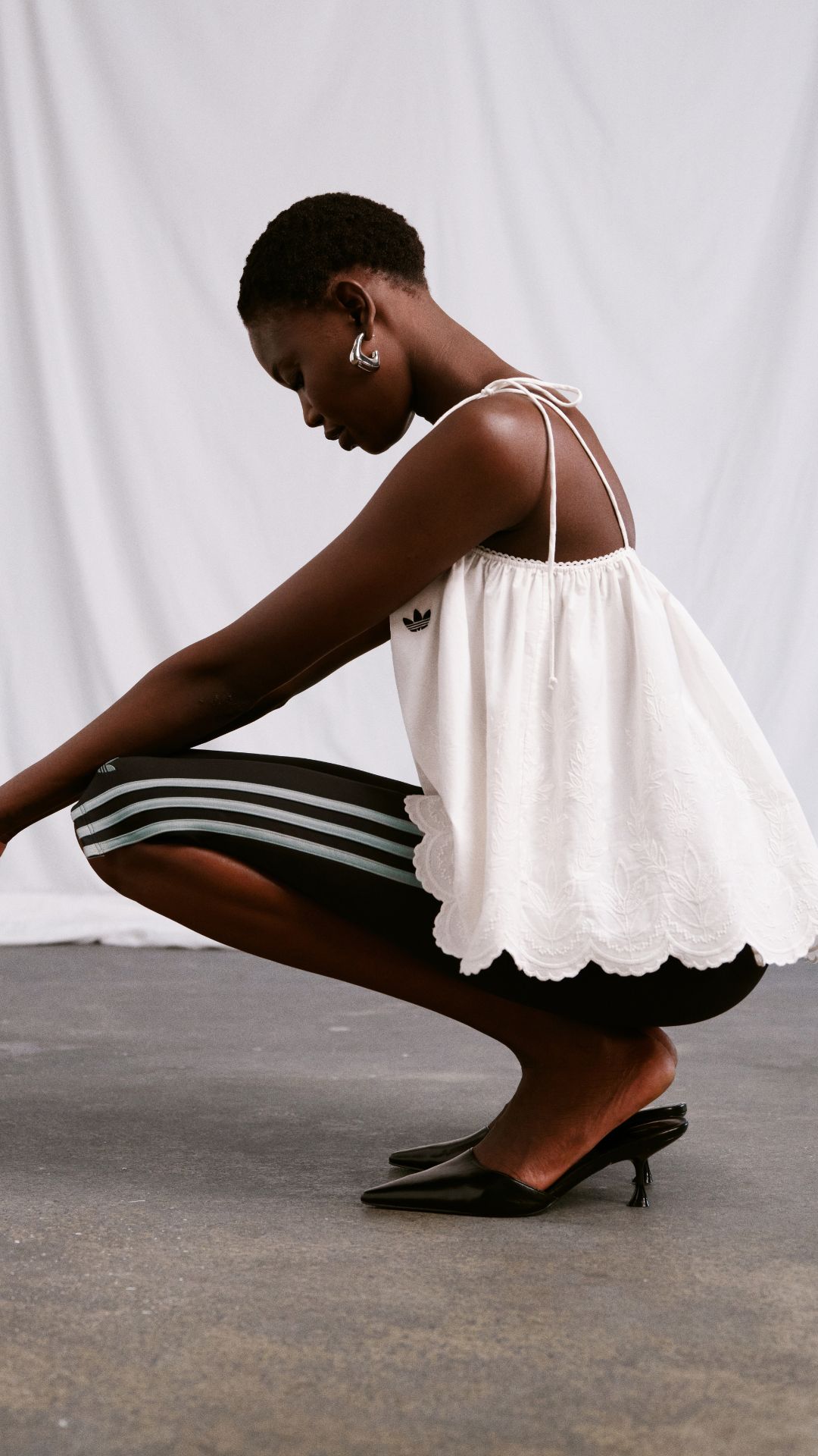 A MODEL WEARING THE NEW ADIDAS X ASOS COLLABORATION