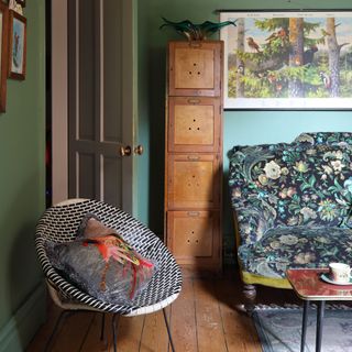 vintage style living room with sputnik chair and victorian sofa