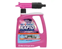 A pink bottle of Wet & Forget patio cleaner with a rapid application sprayer