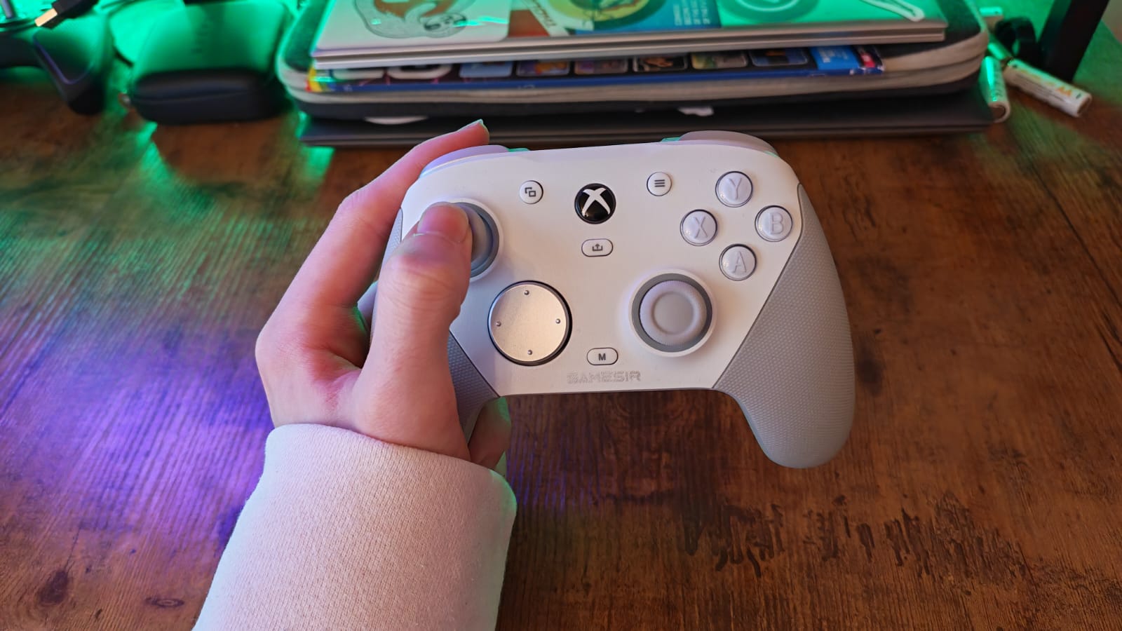 A GameSir G7 Pro controller being held by a reviewer