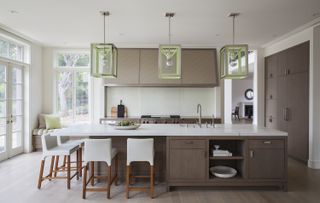 minimalist kitchen with large wood island