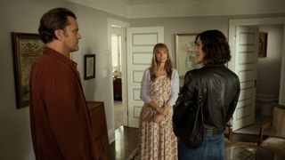 A scene in a domestic setting where Dan (Joshua Jackson) and Alex (Lizzy Caplan) encounter Beth (Amanda Peet). Dan and Alex have their backs to the camera and are looking at each other, Lizzy's expression is almost challenging Dan, who is trying to mask his discomfort that she is here. Beth looks a little off-guard.