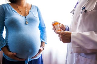 A pregnant woman at a doctor visit.