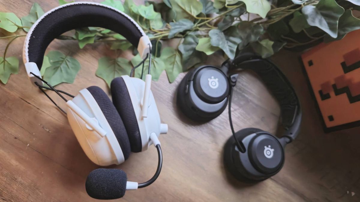 Photo of the Razer BlackShark V2 Pro and the SteelSeries Arctis Nova 5P headset on a wooden table.