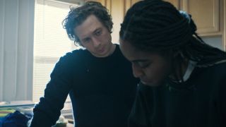 Jeremy Allen White looking at Ayo Edebiri in The Bear.