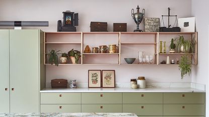 A mid-century inspired kitchen in pale green