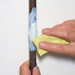 Fixing a pipe with epoxy putty