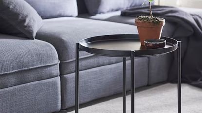 IKEA Gladom black side table in a living room with a grey sofa