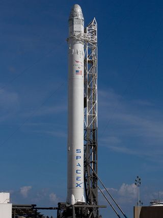 The SpaceX Falcon 9 rocket carrying the first Dragon spacecraft bound for the International Space Station is seen restingatop SpaceX’s launch site in Cape Canaveral, Fla.